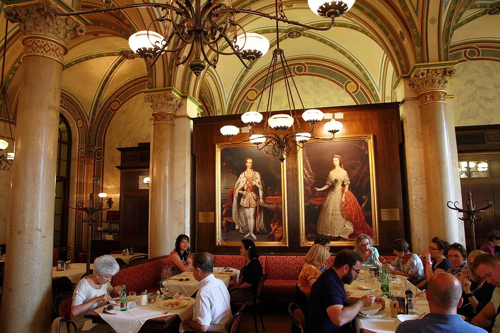 Cafe Central in Vienna interior near portraits